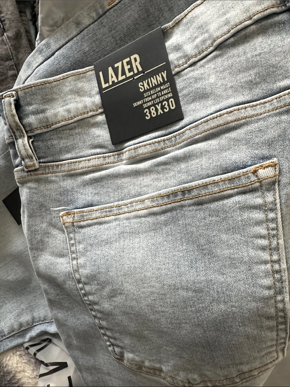 LAZER Men’s Light Blue Skinny Jeans with Distressed Details